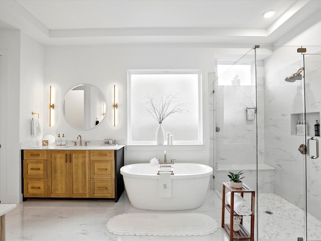 bathroom featuring a soaking tub, a marble finish shower, marble finish floor, and vanity