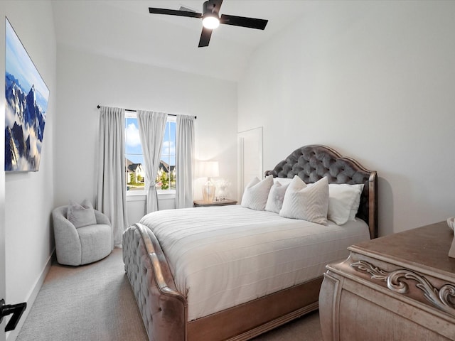 bedroom with baseboards, carpet flooring, ceiling fan, and lofted ceiling