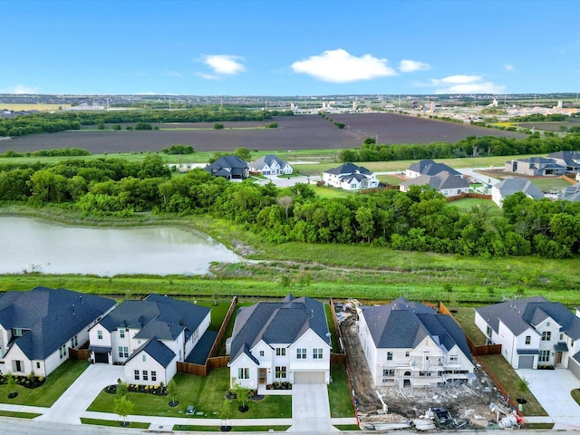 birds eye view of property featuring a residential view and a water view