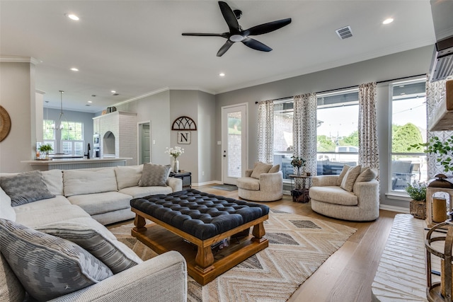 122 Forest Hills Cir, Gunter, TX 75058 - living room featuring recessed lighting, wood finished floors, ceiling fan, visible vents, and crown molding