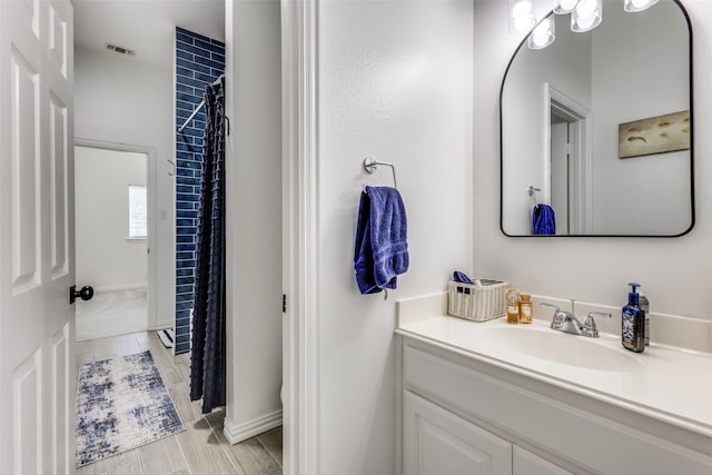 122 Forest Hills Cir, Gunter, TX 75058 - bathroom with visible vents, baseboards, vanity, and a shower with shower curtain