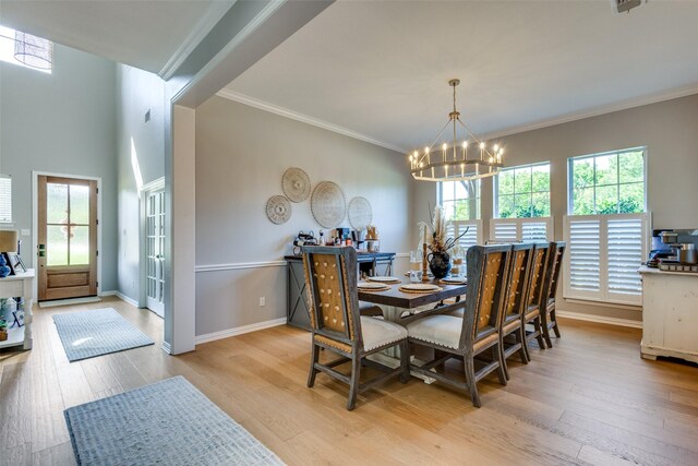 122 Forest Hills Cir, Gunter, TX 75058 - dining area with ornamental molding, an inviting chandelier, baseboards, and light wood-style floors