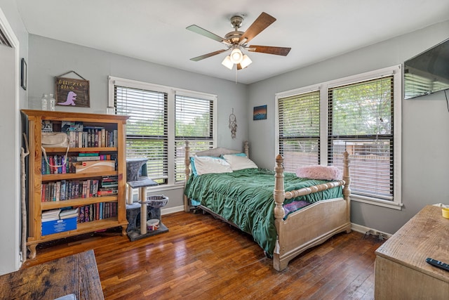 bedroom with wood-type flooring, baseboards, and ceiling fan