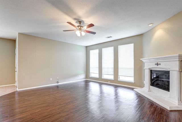 1108 Mourning Dove Dr, Burleson, TX 76028 - unfurnished living room with baseboards, ceiling fan, dark wood-style flooring, and visible vents