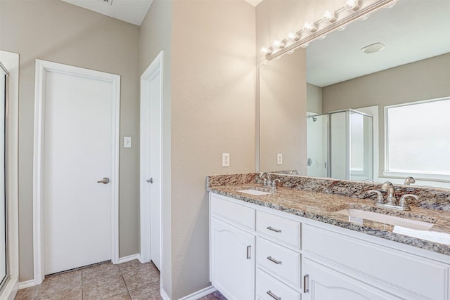 1108 Mourning Dove Dr, Burleson, TX 76028 - bathroom featuring double vanity, a shower stall, and a sink