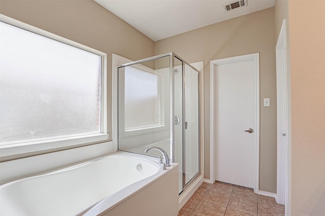 1108 Mourning Dove Dr, Burleson, TX 76028 - bathroom featuring tile patterned flooring, baseboards, a shower stall, visible vents, and a bath