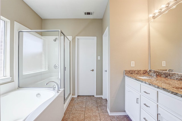 1108 Mourning Dove Dr, Burleson, TX 76028 - full bathroom with visible vents, vanity, baseboards, a bath, and a stall shower