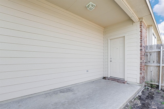 1108 Mourning Dove Dr, Burleson, TX 76028 - doorway to property with brick siding, fence, and a patio area