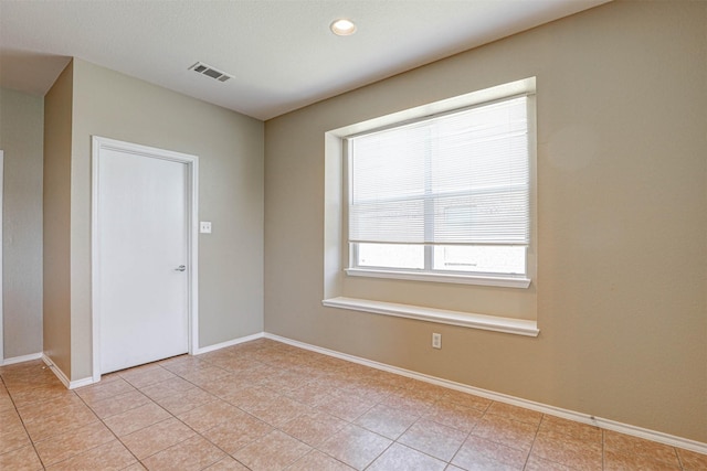 1108 Mourning Dove Dr, Burleson, TX 76028 - empty room featuring visible vents, baseboards, and light tile patterned floors