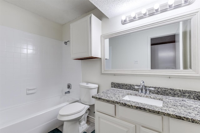 full bath featuring vanity, shower / bathing tub combination, toilet, and a textured ceiling