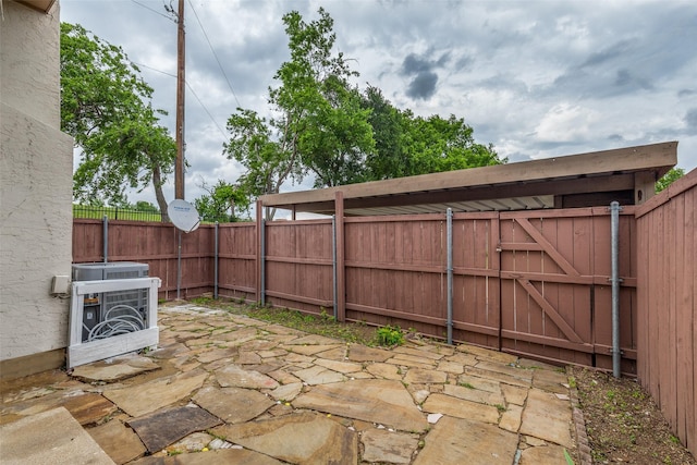 view of patio featuring a fenced backyard and cooling unit