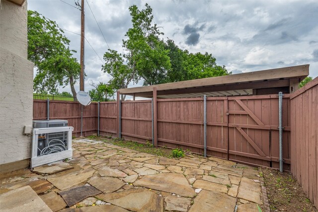 13208 Woodbend Ln, Dallas, TX 75243 - fenced backyard featuring a patio