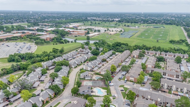 drone / aerial view with a residential view and a water view
