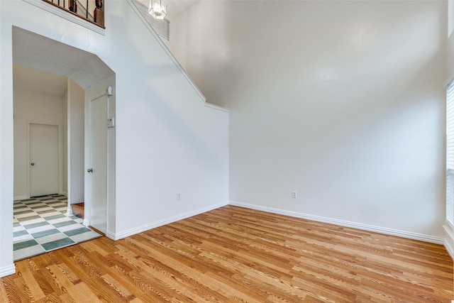 interior space featuring baseboards and light wood-type flooring