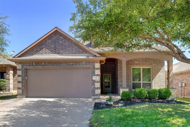 1441 Elkford Ln, Fort Worth, TX 76247 - view of front of home featuring a garage, driveway, and brick siding