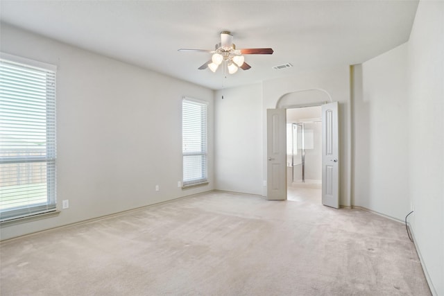 1441 Elkford Ln, Fort Worth, TX 76247 - unfurnished bedroom with light carpet, multiple windows, baseboards, and ceiling fan