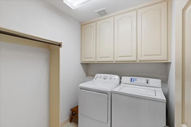 125 Deer Stream Ct, Azle, TX 76020 - laundry area with cabinet space, washer and clothes dryer, and visible vents
