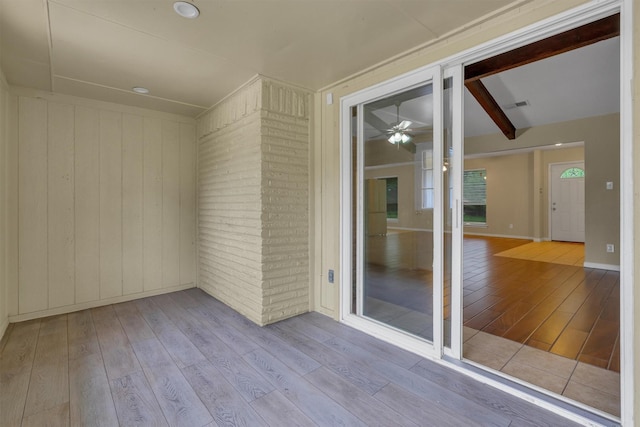 unfurnished sunroom featuring visible vents
