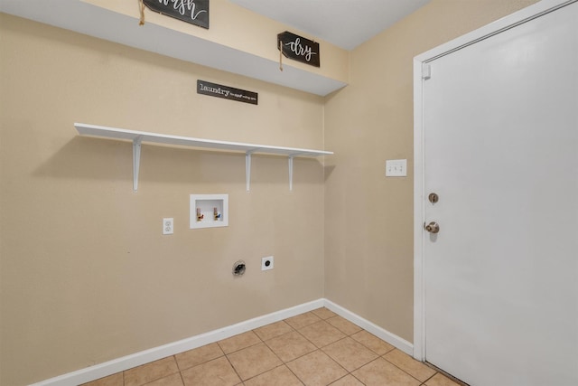 washroom with washer hookup, hookup for an electric dryer, laundry area, light tile patterned floors, and baseboards