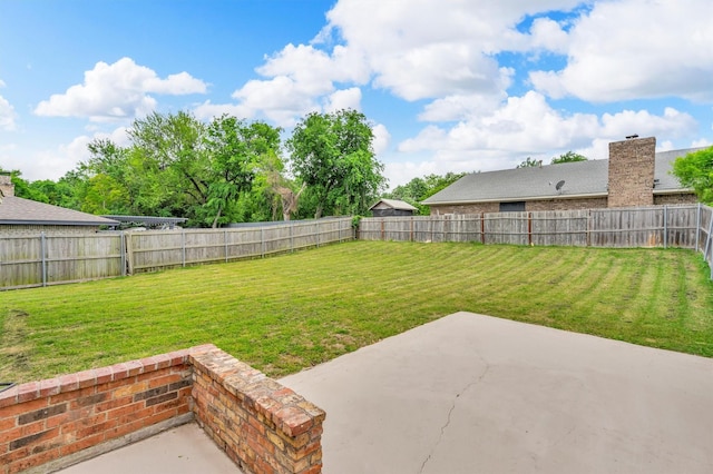 view of yard featuring a patio and a fenced backyard