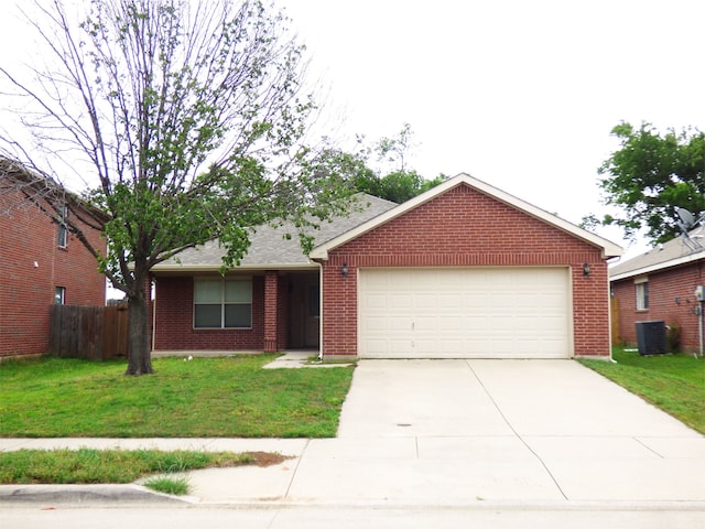 ranch-style house with fence, a front yard, concrete driveway, and an attached garage