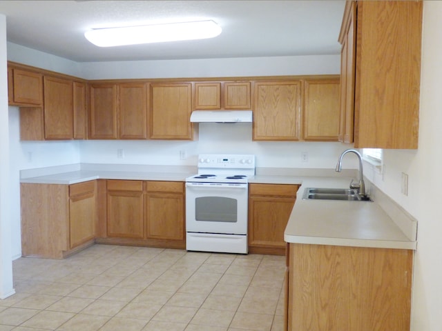 kitchen featuring light tile patterned floors, a sink, light countertops, under cabinet range hood, and electric range
