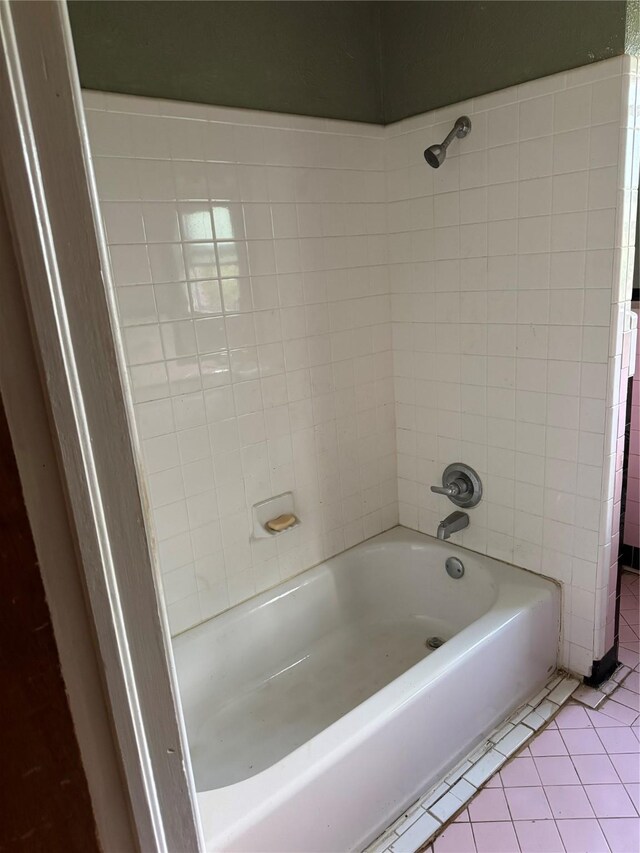 full bath with tile patterned floors and shower / tub combination