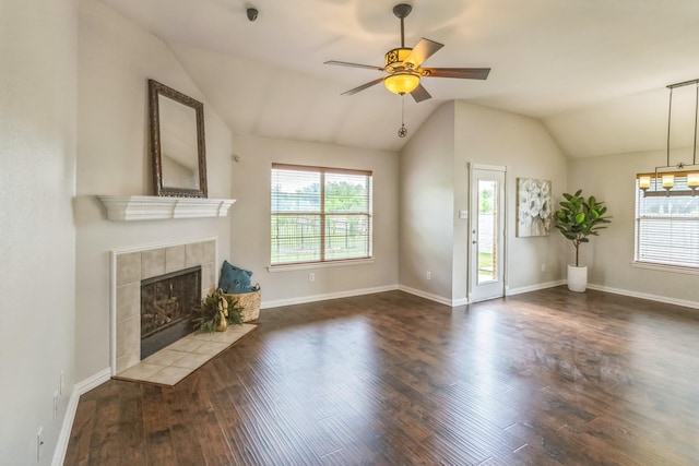 unfurnished living room with a healthy amount of sunlight, ceiling fan, and vaulted ceiling
