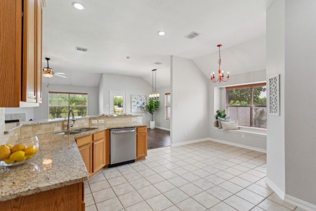kitchen featuring a sink, visible vents, a peninsula, vaulted ceiling, and stainless steel dishwasher