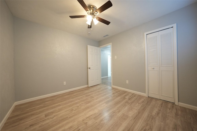 1121 Stone Trail Dr, Plano, TX 75023 - unfurnished bedroom with light wood-style flooring, baseboards, a closet, and a ceiling fan