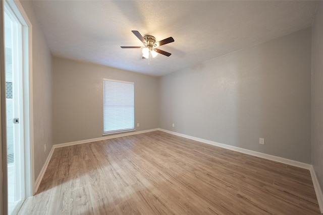 1121 Stone Trail Dr, Plano, TX 75023 - empty room with light wood-type flooring, ceiling fan, and baseboards