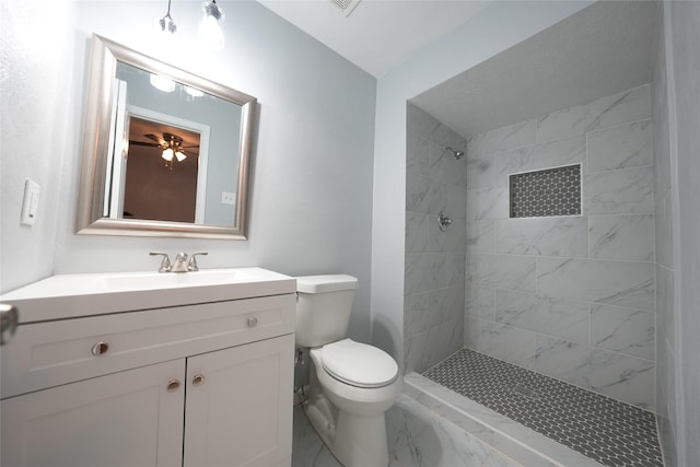 1121 Stone Trail Dr, Plano, TX 75023 - full bathroom featuring tiled shower, marble finish floors, toilet, vanity, and ceiling fan