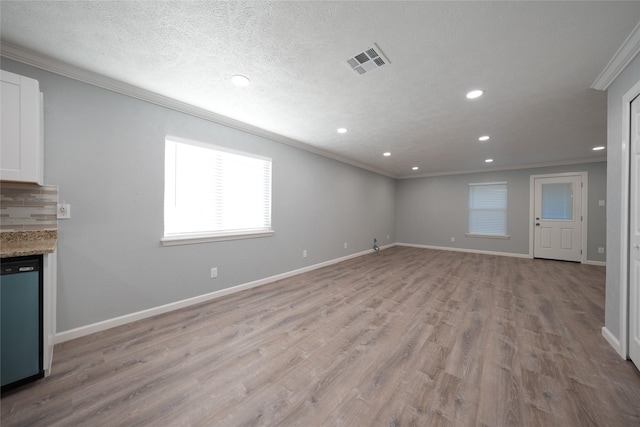 1121 Stone Trail Dr, Plano, TX 75023 - unfurnished living room with ornamental molding, recessed lighting, light wood finished floors, and baseboards