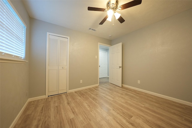 1121 Stone Trail Dr, Plano, TX 75023 - unfurnished bedroom featuring light wood-style flooring, baseboards, and ceiling fan