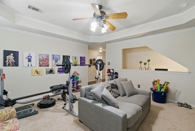 interior space with visible vents, a raised ceiling, ceiling fan, and carpet floors