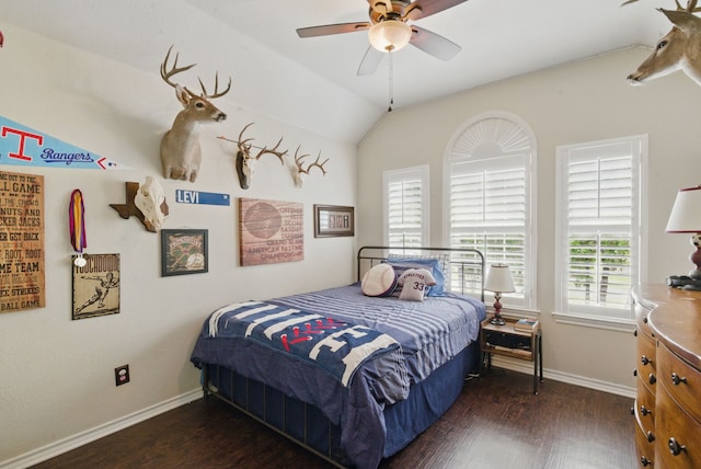 bedroom featuring a ceiling fan, wood finished floors, lofted ceiling, and baseboards