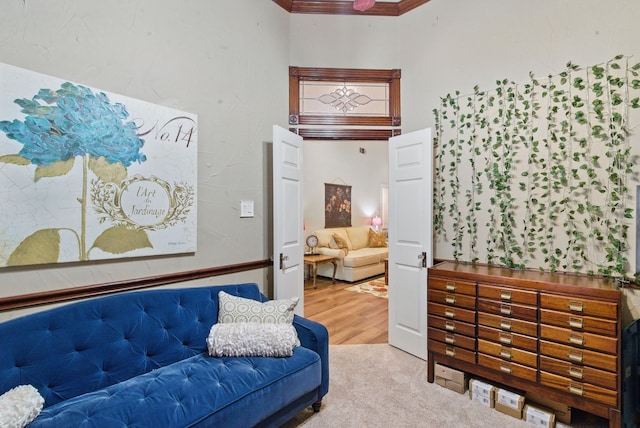 interior space featuring wood finished floors and crown molding
