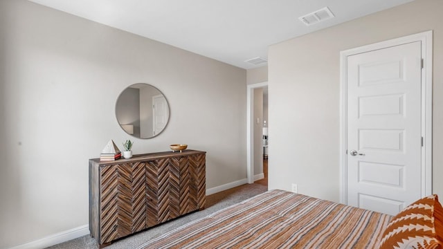 bedroom with baseboards, visible vents, and carpet floors