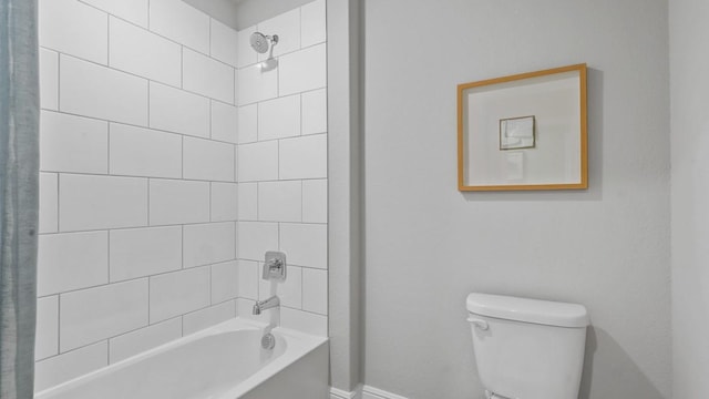 full bathroom with shower / bath combo with shower curtain, toilet, and baseboards
