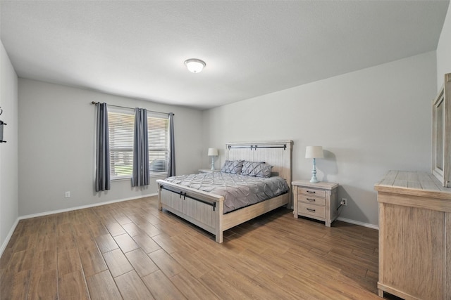 6309 Outrigger Rd, Fort Worth, TX 76179 - bedroom featuring wood finished floors and baseboards