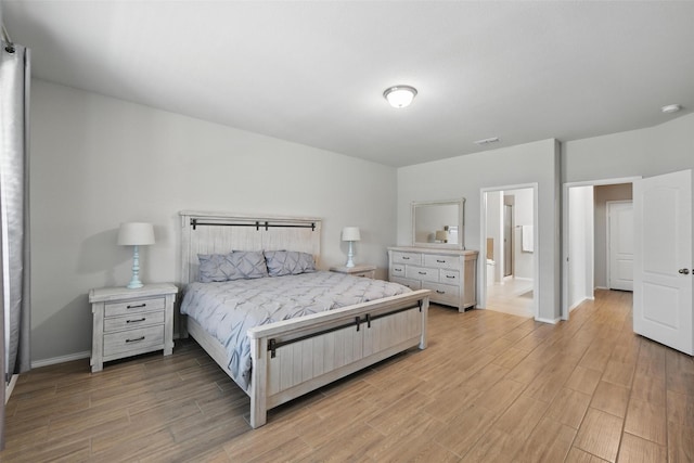 6309 Outrigger Rd, Fort Worth, TX 76179 - bedroom featuring light wood-style flooring, baseboards, and ensuite bath
