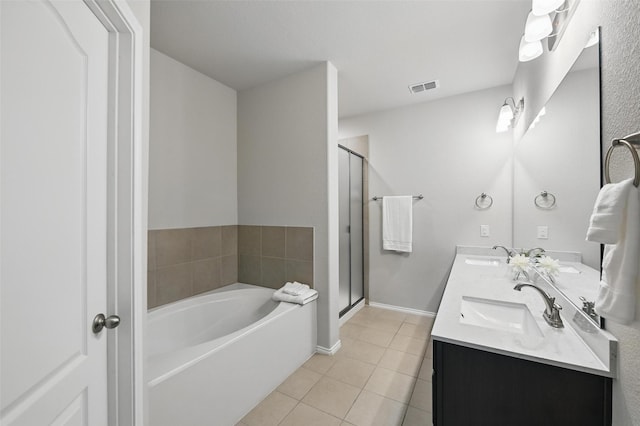 6309 Outrigger Rd, Fort Worth, TX 76179 - full bath featuring tile patterned floors, a bath, a shower stall, double vanity, and baseboards