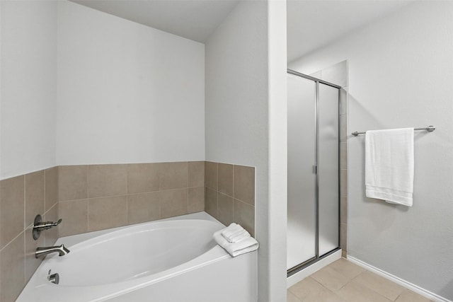 6309 Outrigger Rd, Fort Worth, TX 76179 - bathroom featuring a stall shower, a bath, tile patterned floors, and baseboards