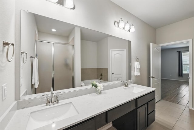 6309 Outrigger Rd, Fort Worth, TX 76179 - bathroom featuring a shower stall, double vanity, a bath, and tile patterned flooring