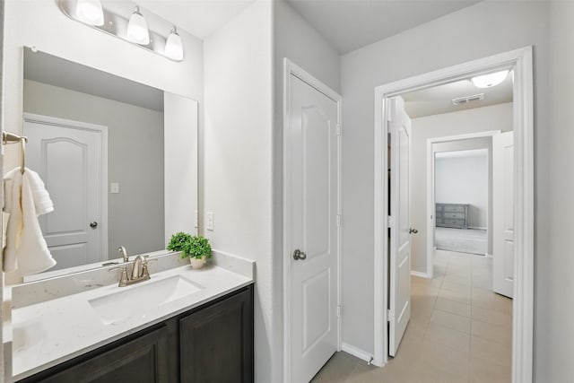 6309 Outrigger Rd, Fort Worth, TX 76179 - bathroom with tile patterned floors, vanity, and baseboards