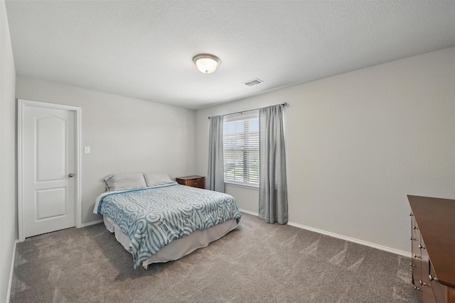 6309 Outrigger Rd, Fort Worth, TX 76179 - carpeted bedroom with baseboards and a textured ceiling