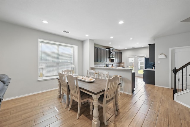 6309 Outrigger Rd, Fort Worth, TX 76179 - dining space with stairway, light wood-style flooring, recessed lighting, and baseboards