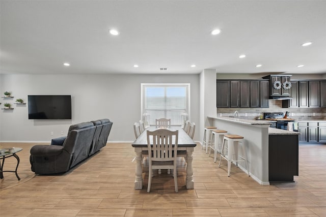 6309 Outrigger Rd, Fort Worth, TX 76179 - dining space with light wood-style floors, recessed lighting, and baseboards