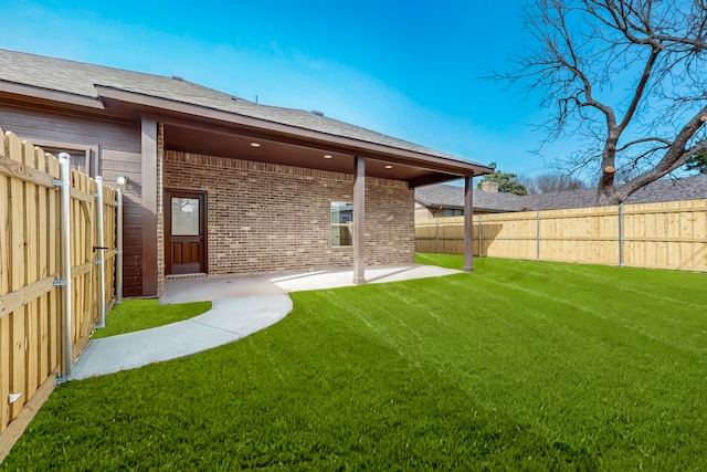 706 Poinsettia Dr, Lancaster, TX 75146 - back of house featuring brick siding, a fenced backyard, and a patio area
