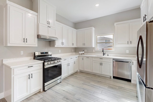 706 Poinsettia Dr, Lancaster, TX 75146 - kitchen featuring stainless steel appliances, white cabinetry, light countertops, under cabinet range hood, and recessed lighting